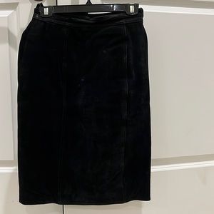 CHIA is the brand name.A black vintage suede skirt.